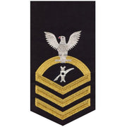 Navy E7 MALE Rating Badge: Legalman - seaworthy gold on blue